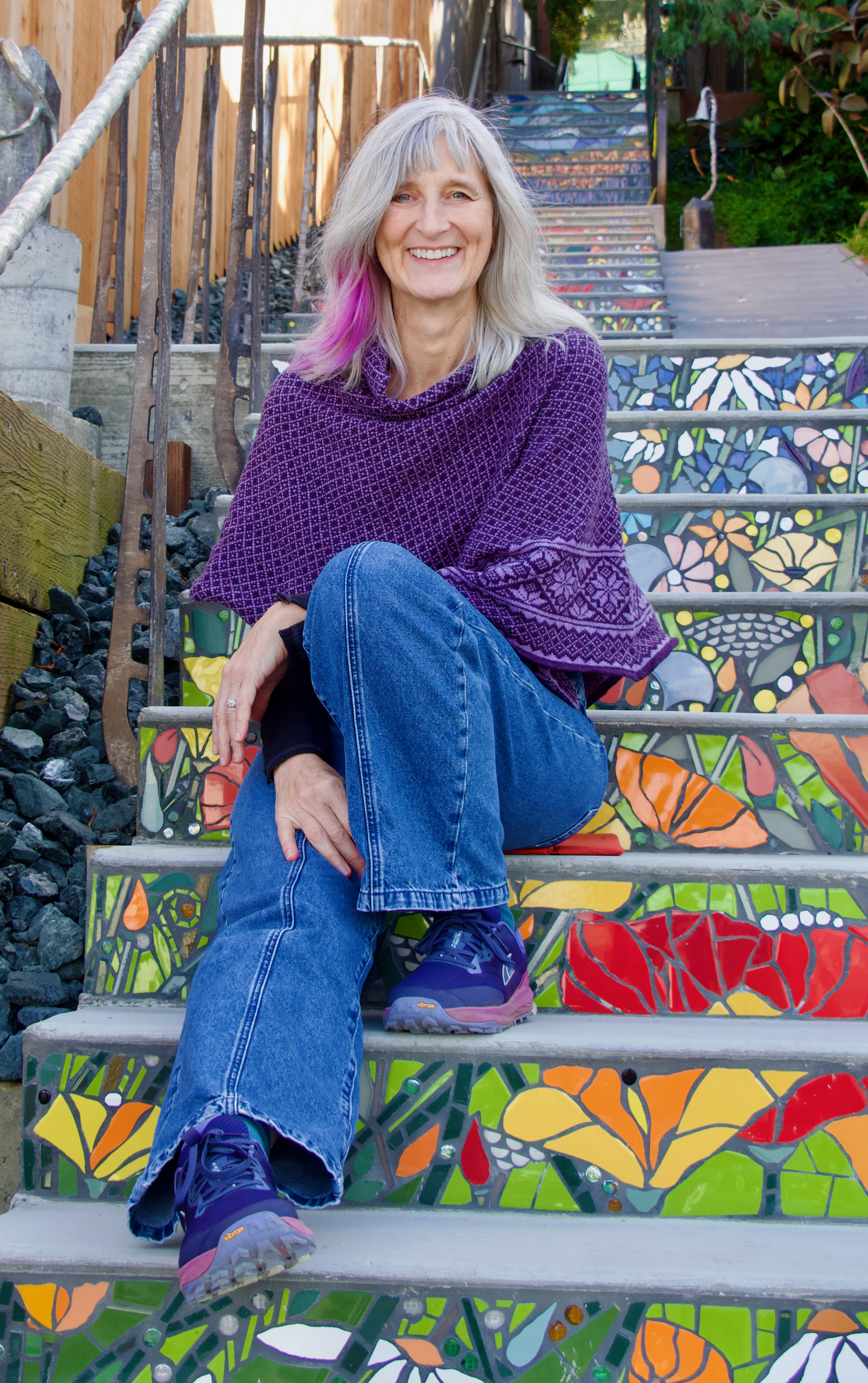 Marymoore Patterson seated on mosaic-tiled steps outdoors